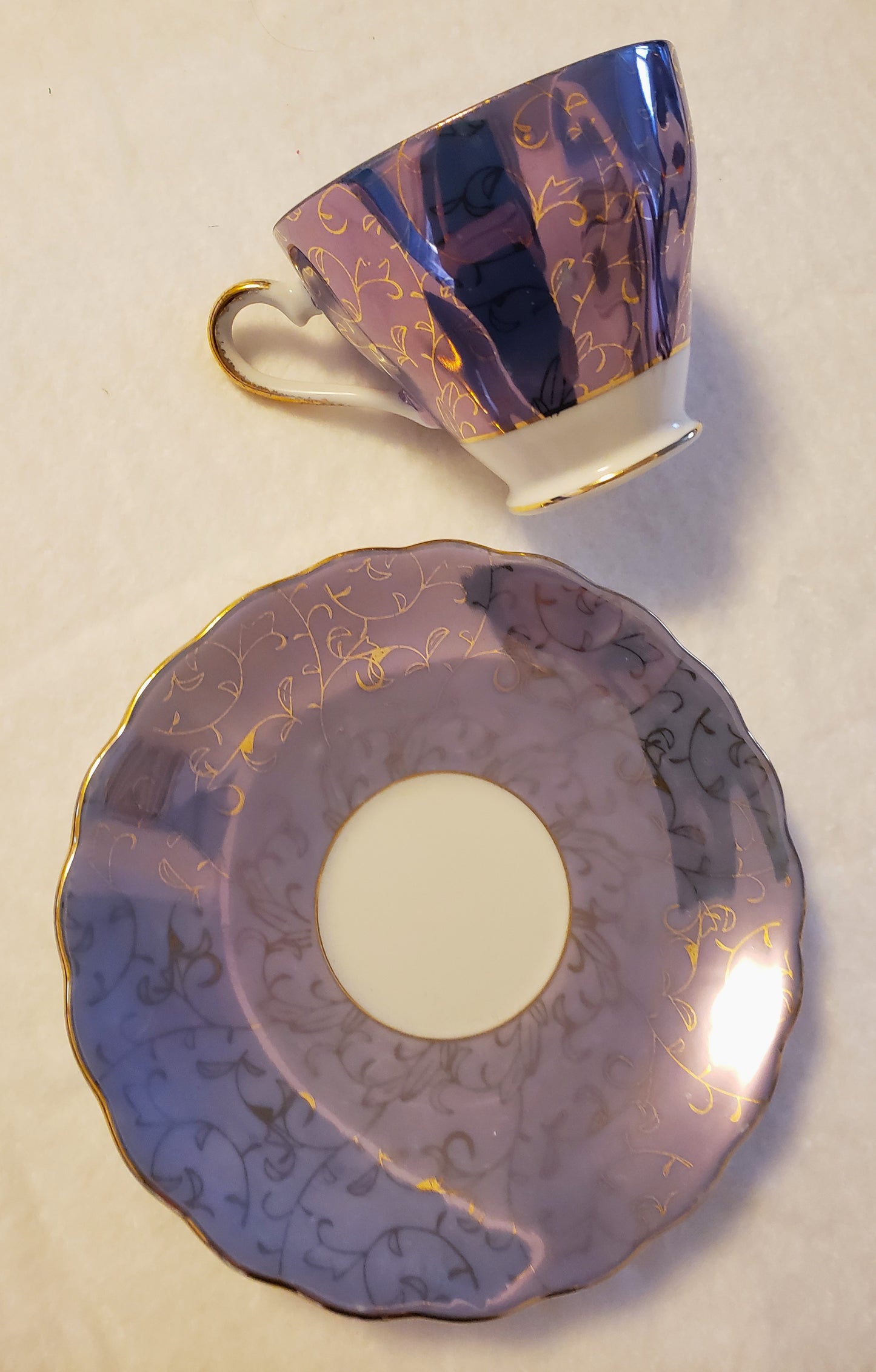 Iridescent Blue and Gold Tea Cup and Saucer