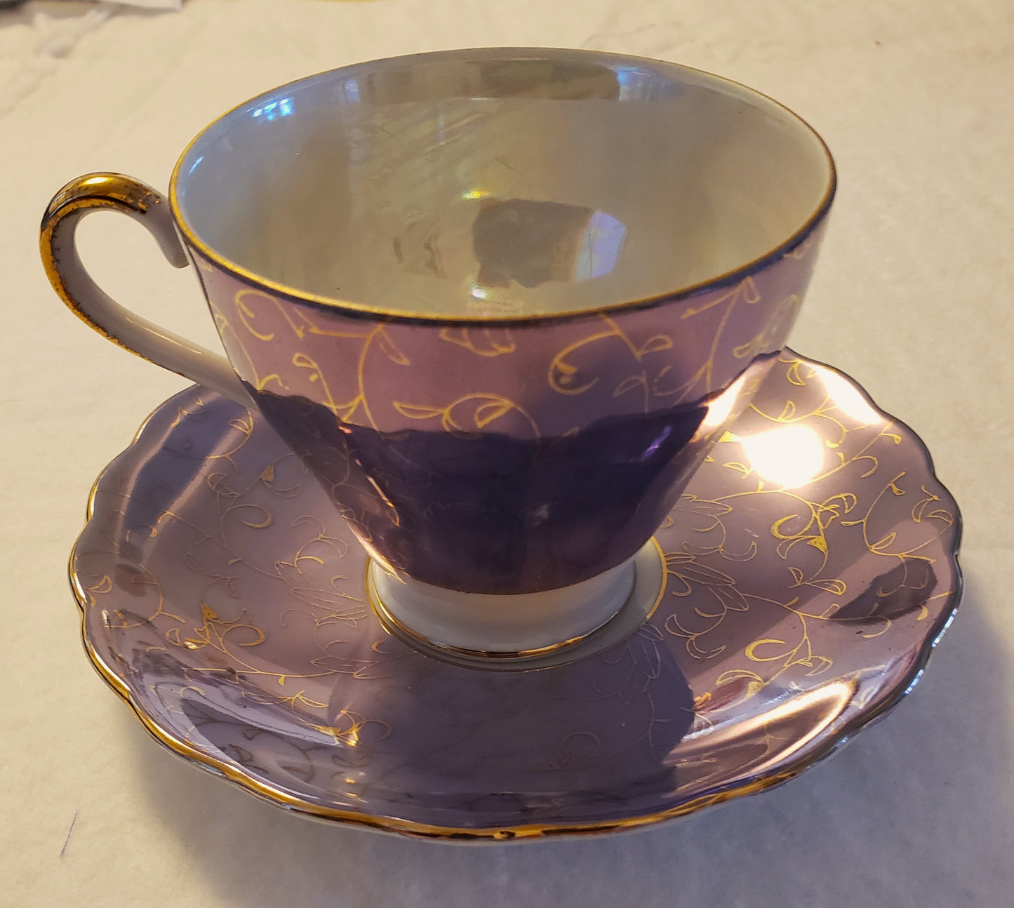 Iridescent Blue and Gold Tea Cup and Saucer